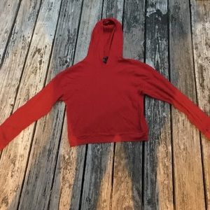 long sleeve, cropped shirt with hood.